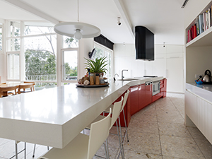 Large designer kitchen in modern Australian home with patio garden outlook